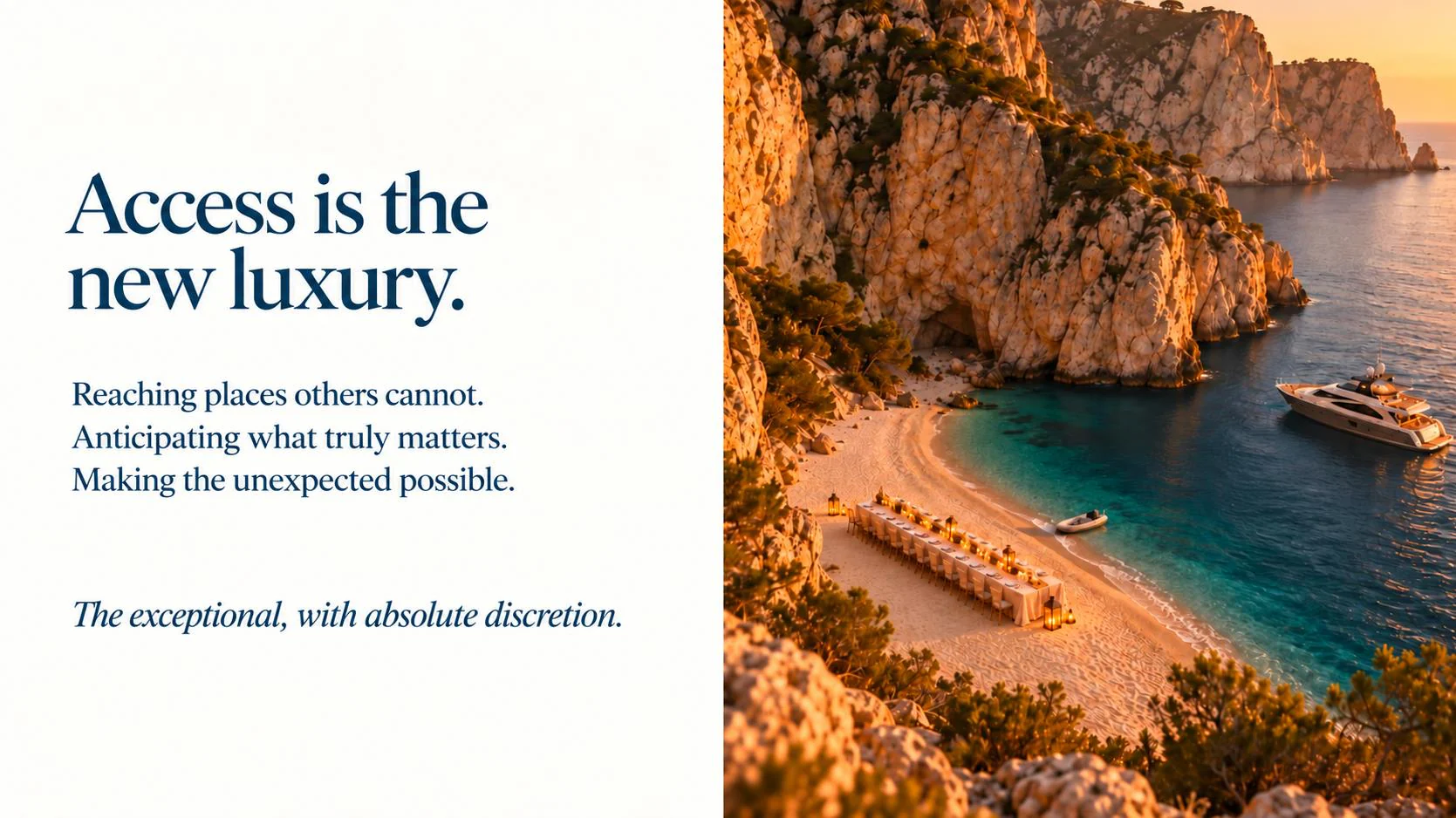 Cove between cliffs with a long table on the sand and a yacht at anchor.
